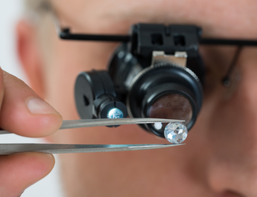High quality GIA-certified diamond being inspected by Jeweler